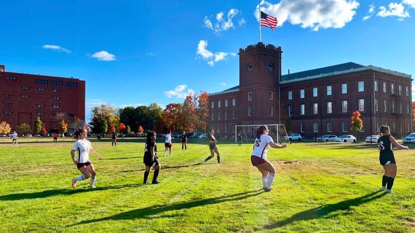 women's soccer game in front of Armory Museum